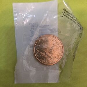 Golden One Dollar Sacagawea Coin in Packaging